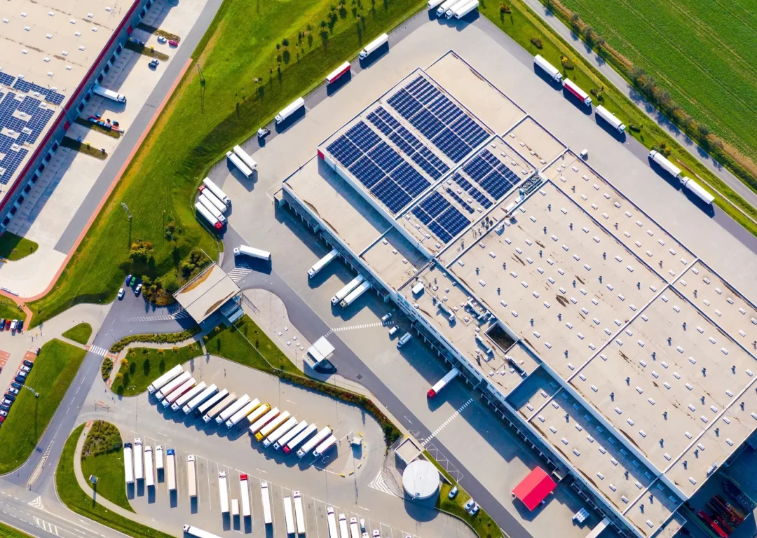 A large commercial site with vehicles and solar panels.